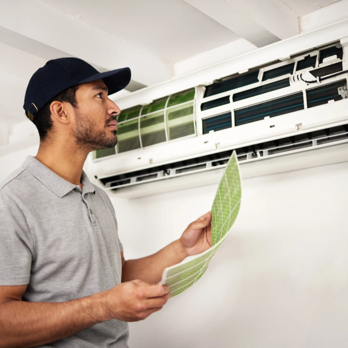 Engineer replacing Dirty Air Filters