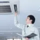 scientist having a look at cassette air conditioning